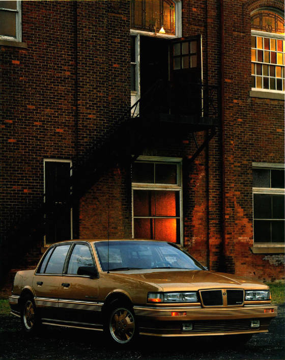 PONTIAC_GRAND_AM/1986pontgrandamse4drgld.jpg